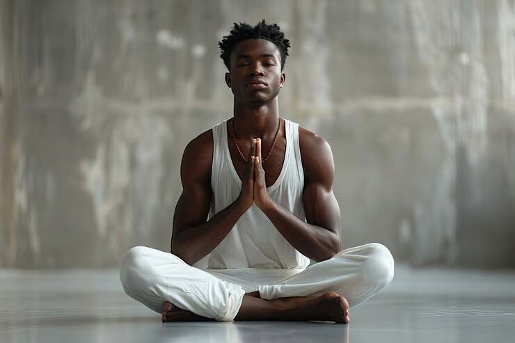 full-shot-black-man-practising-yoga_23-2151425503